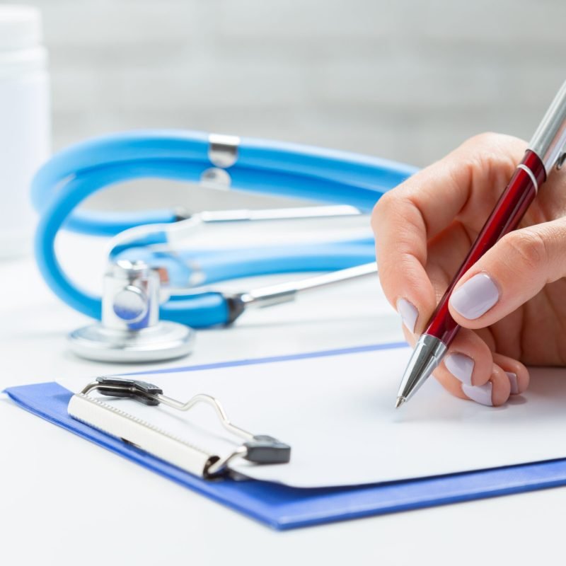 the doctor writes a prescription pil