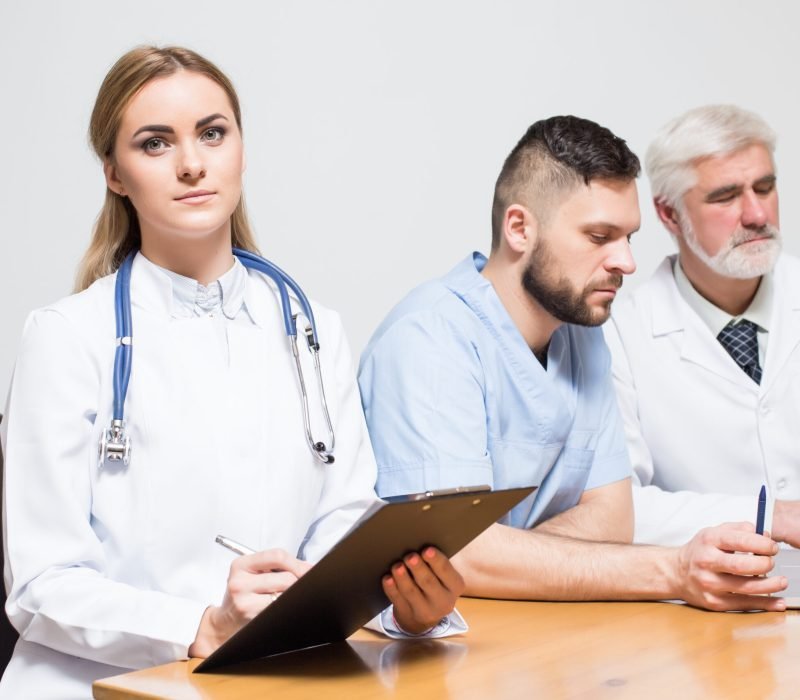 medical team doctors table room notebook